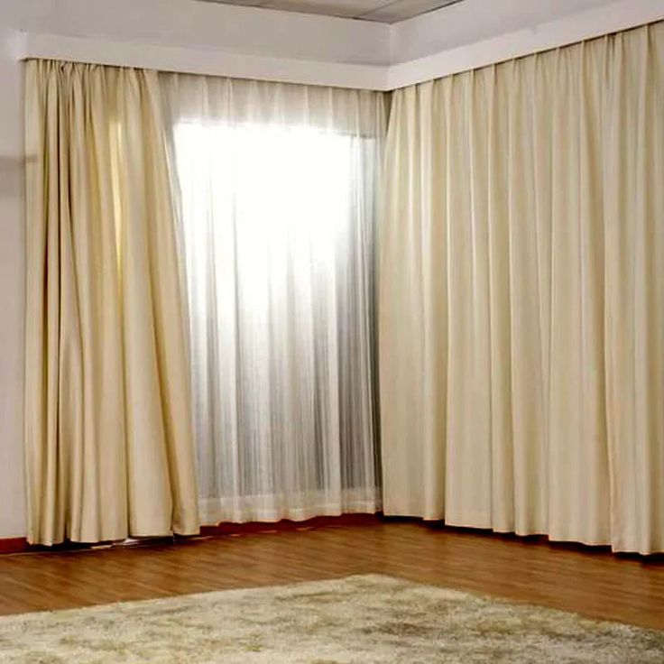 sleek ceiling-mounted drapery track in a modern living room