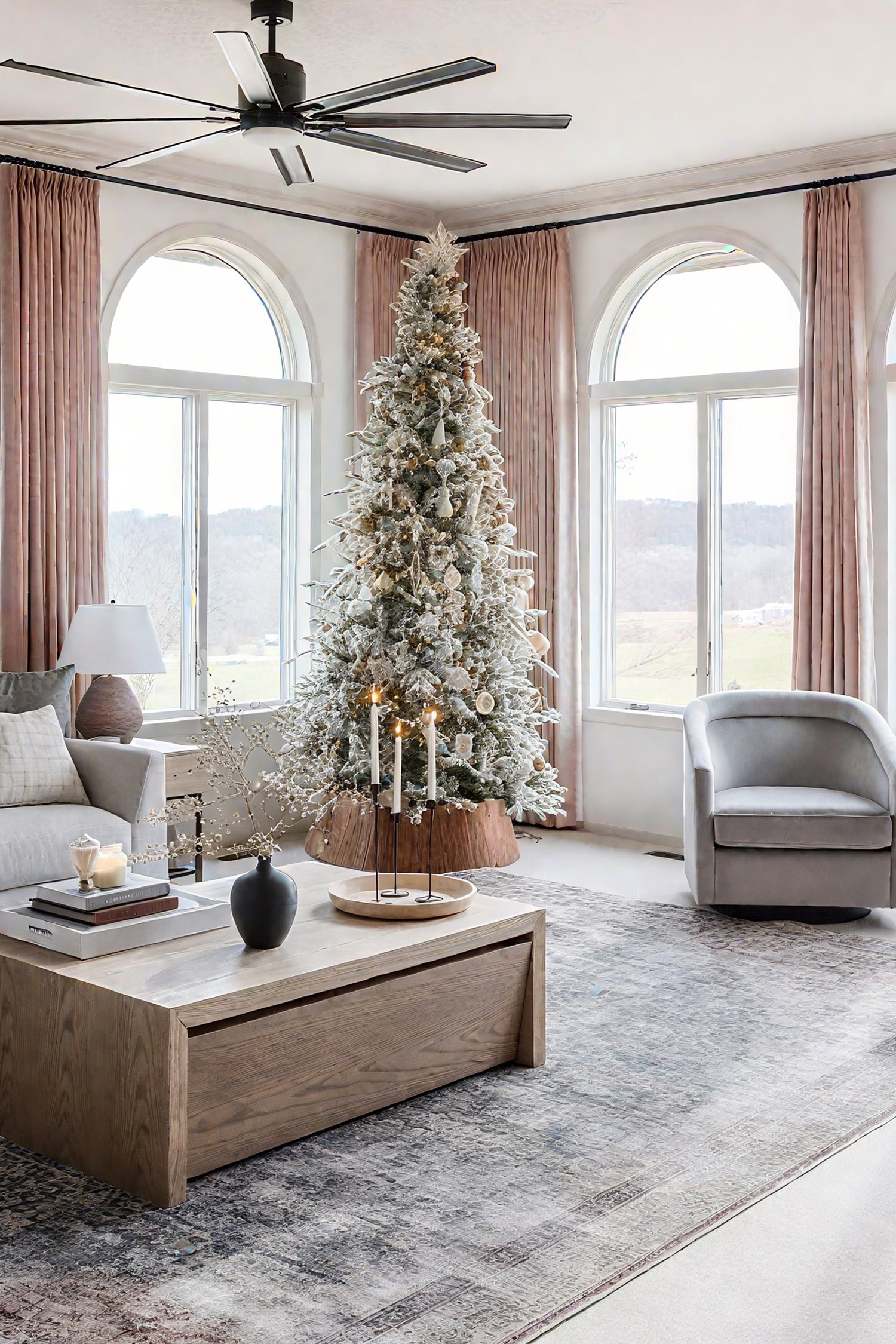 Modern living room with arched windows, pink blackout curtains, and a decorated Christmas tree