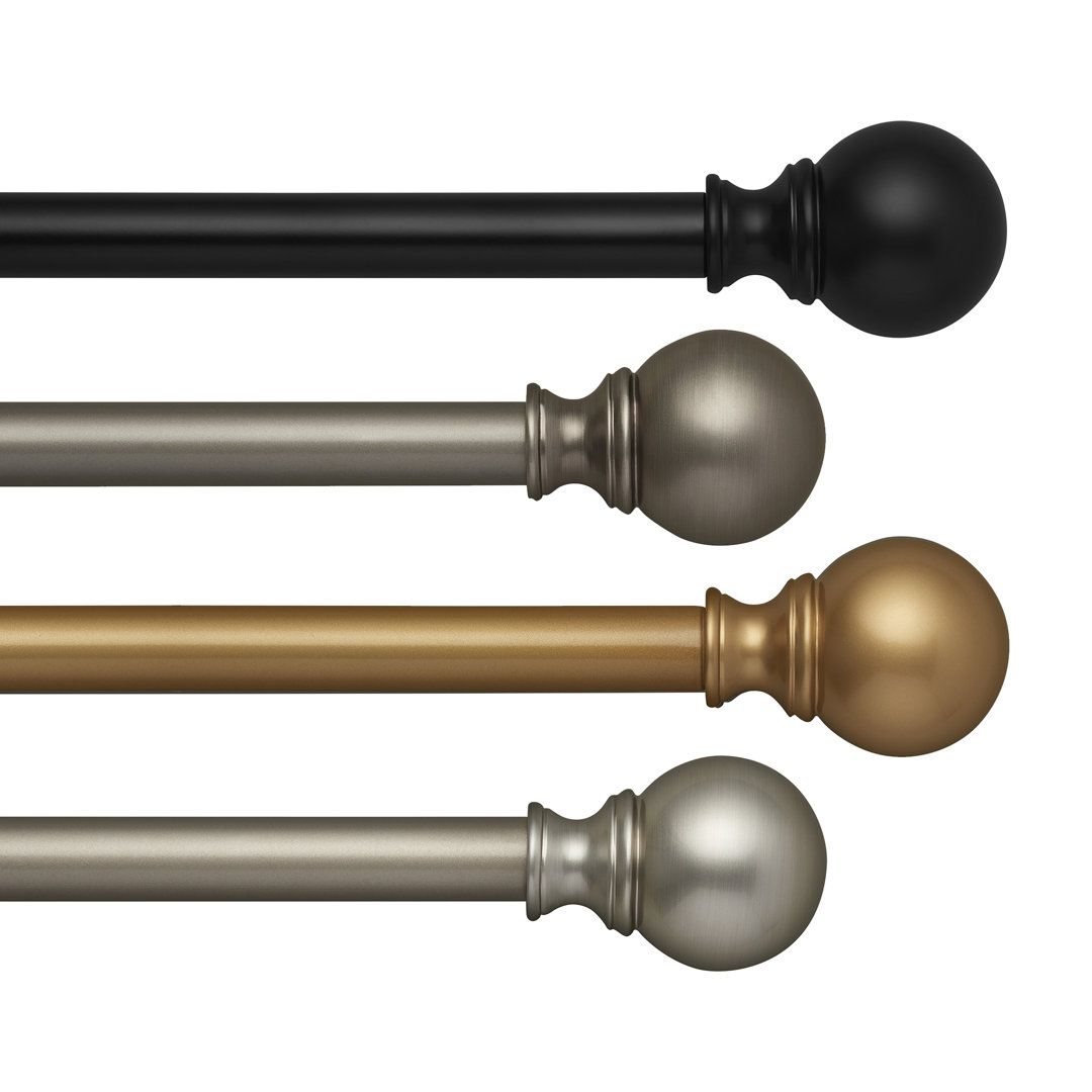 Elegant long curtain rods installed above floor‑length drapes in a modern living room