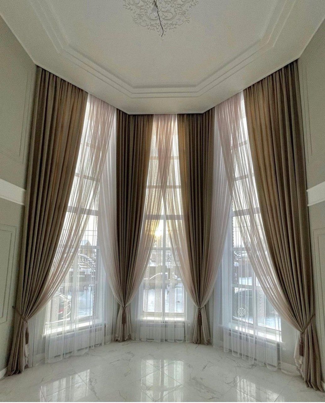 soft white lightweight curtains blowing in a sunlit room