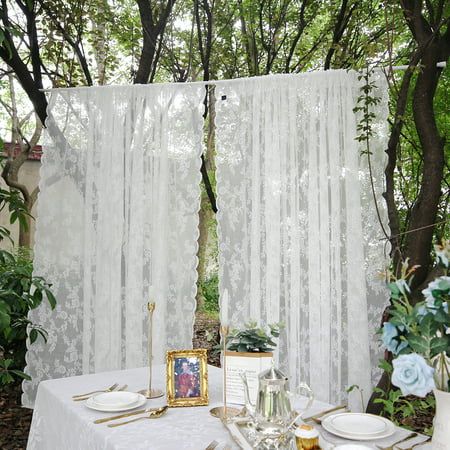 Elegant white sheer curtain fluttering in a sunlit room