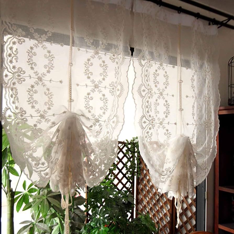 Cozy room with elegant drapes on small windows enhancing the decor