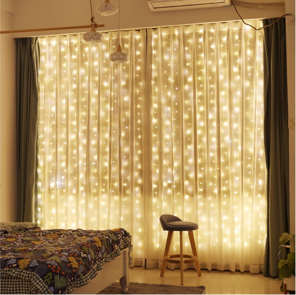 curtains of lights hanging on a bedroom wall creating a cozy and dreamy ambiance