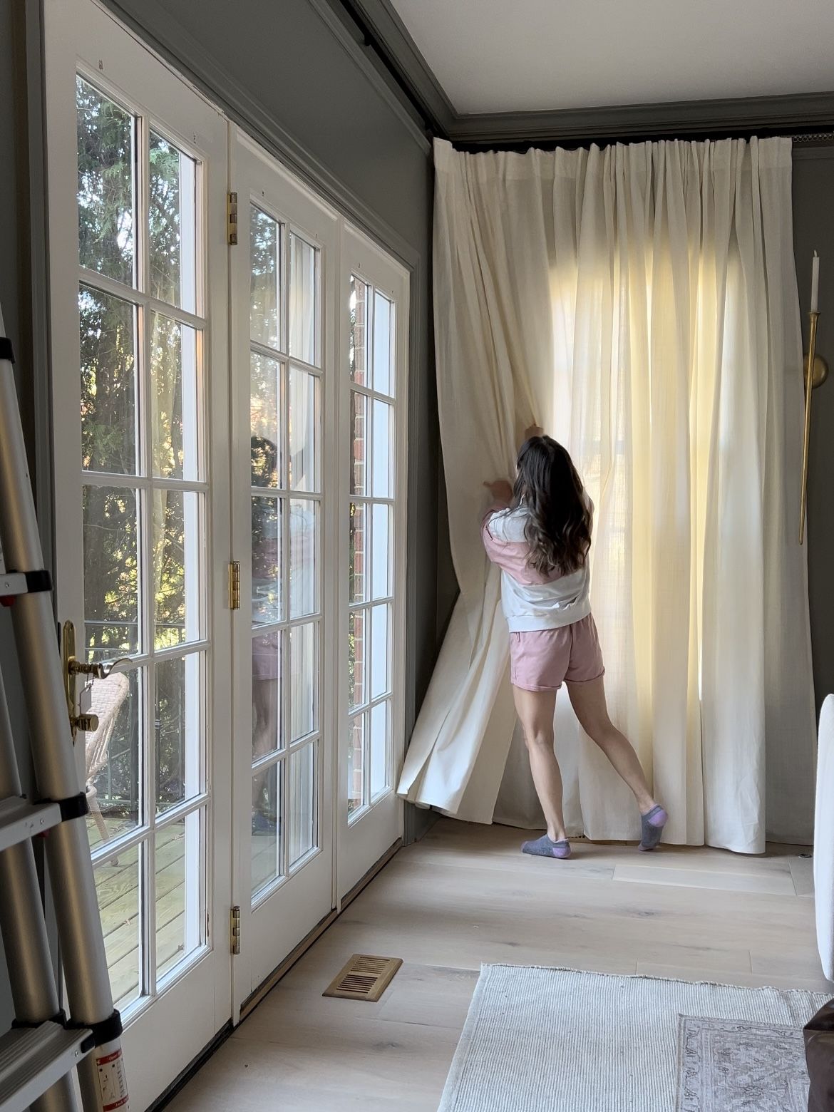 Track curtains installed on a ceiling rail in a modern room