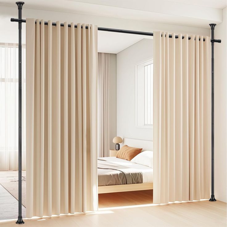 A privacy curtain elegantly dividing a modern studio apartment for personal space