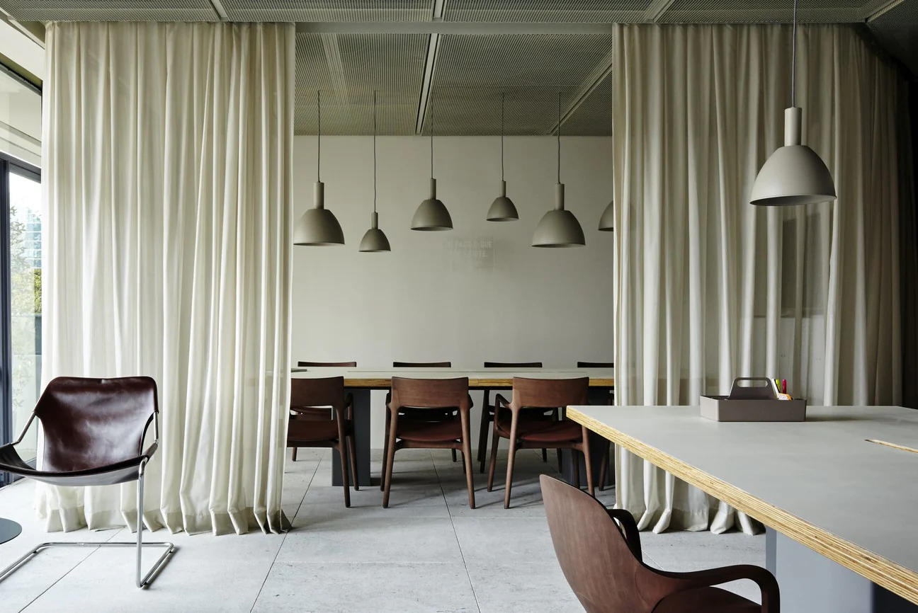 Modern curtain room dividers separating living and bedroom space
