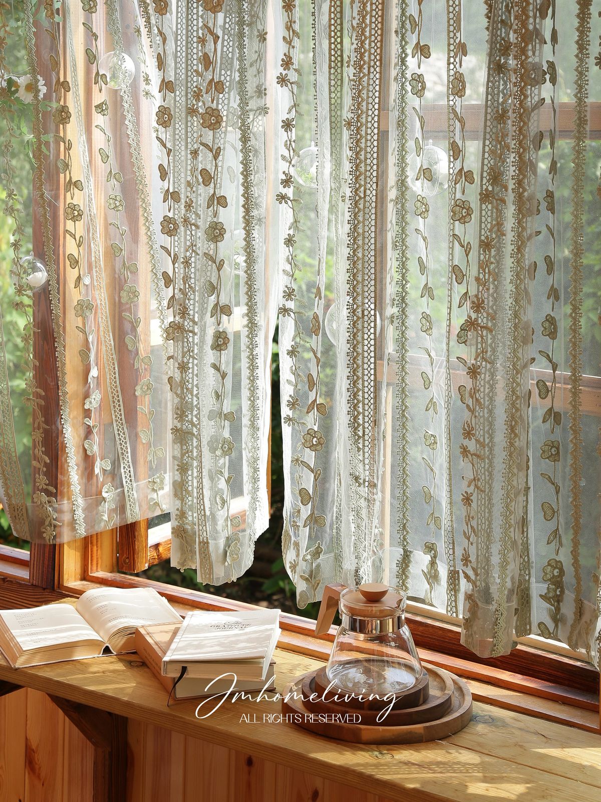 Sunlight streaming through elegant embroidered curtains in a cozy, well-decorated room