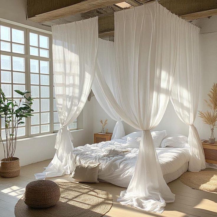 Opulent bedroom featuring layered bedding drapery and flowing bed canopy