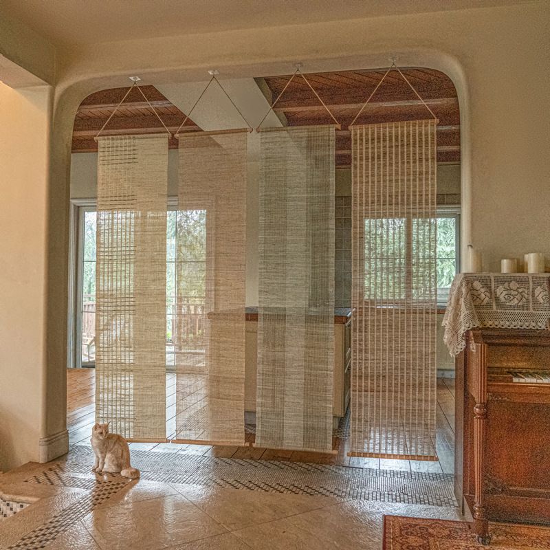 door curtain bar hanging above door frame