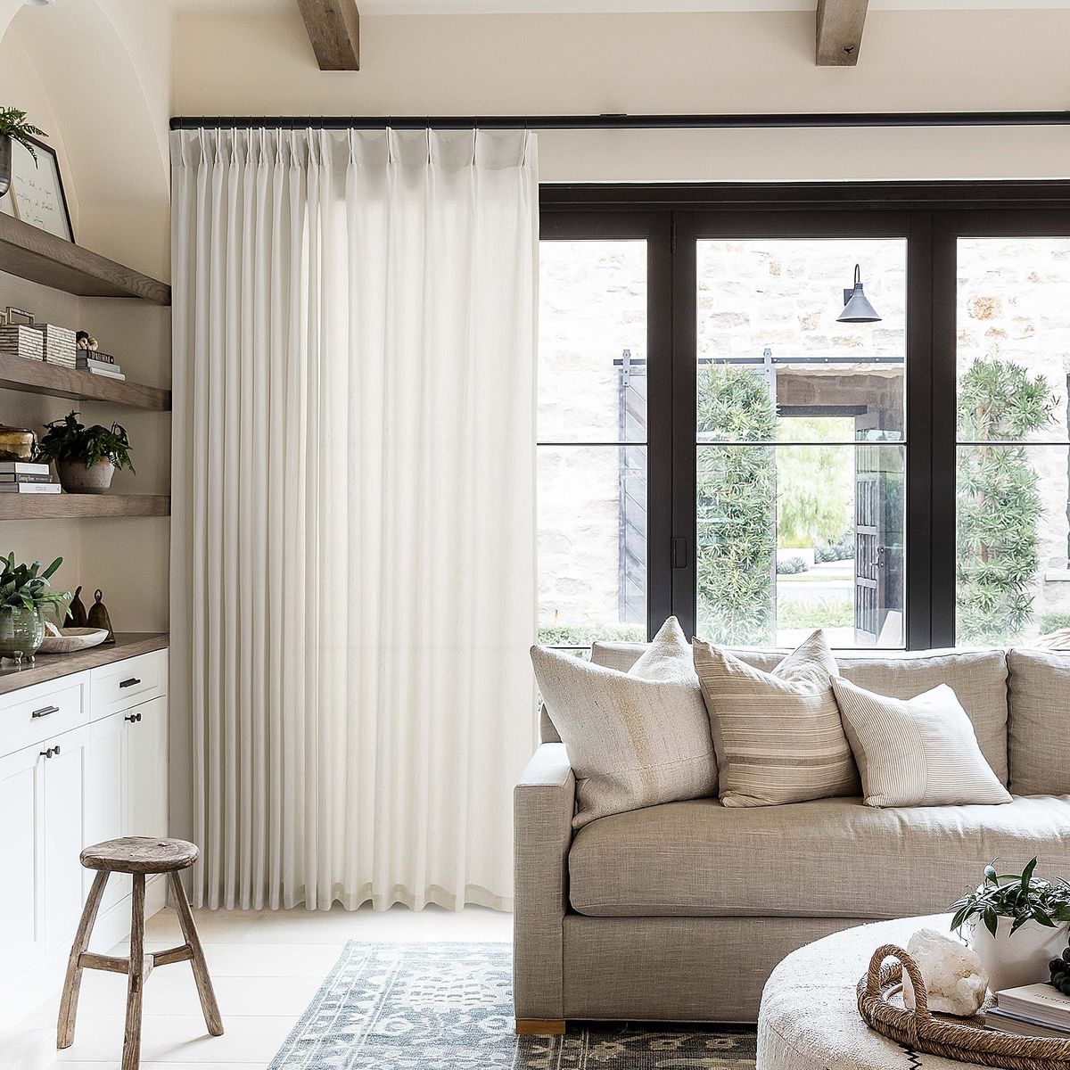 Elegant window curtains framing a cozy living room with modern décor