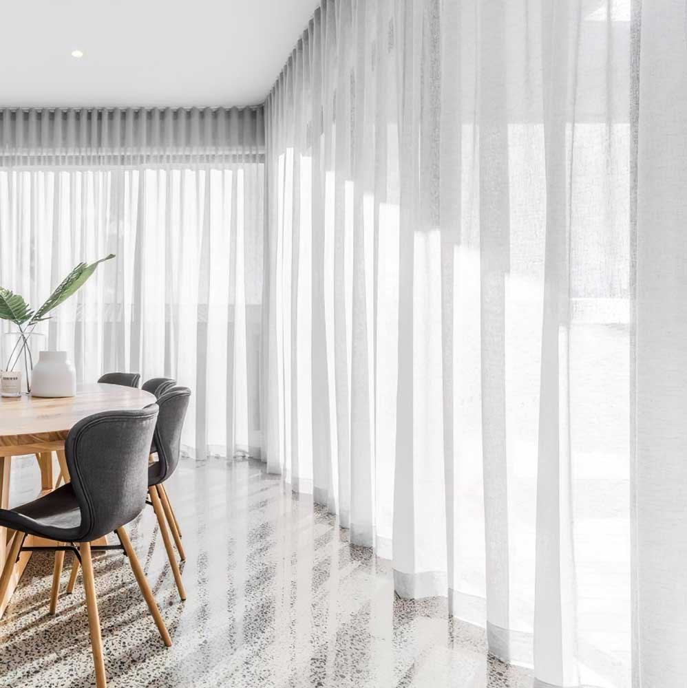 modern curtains in a minimalist living room with natural light