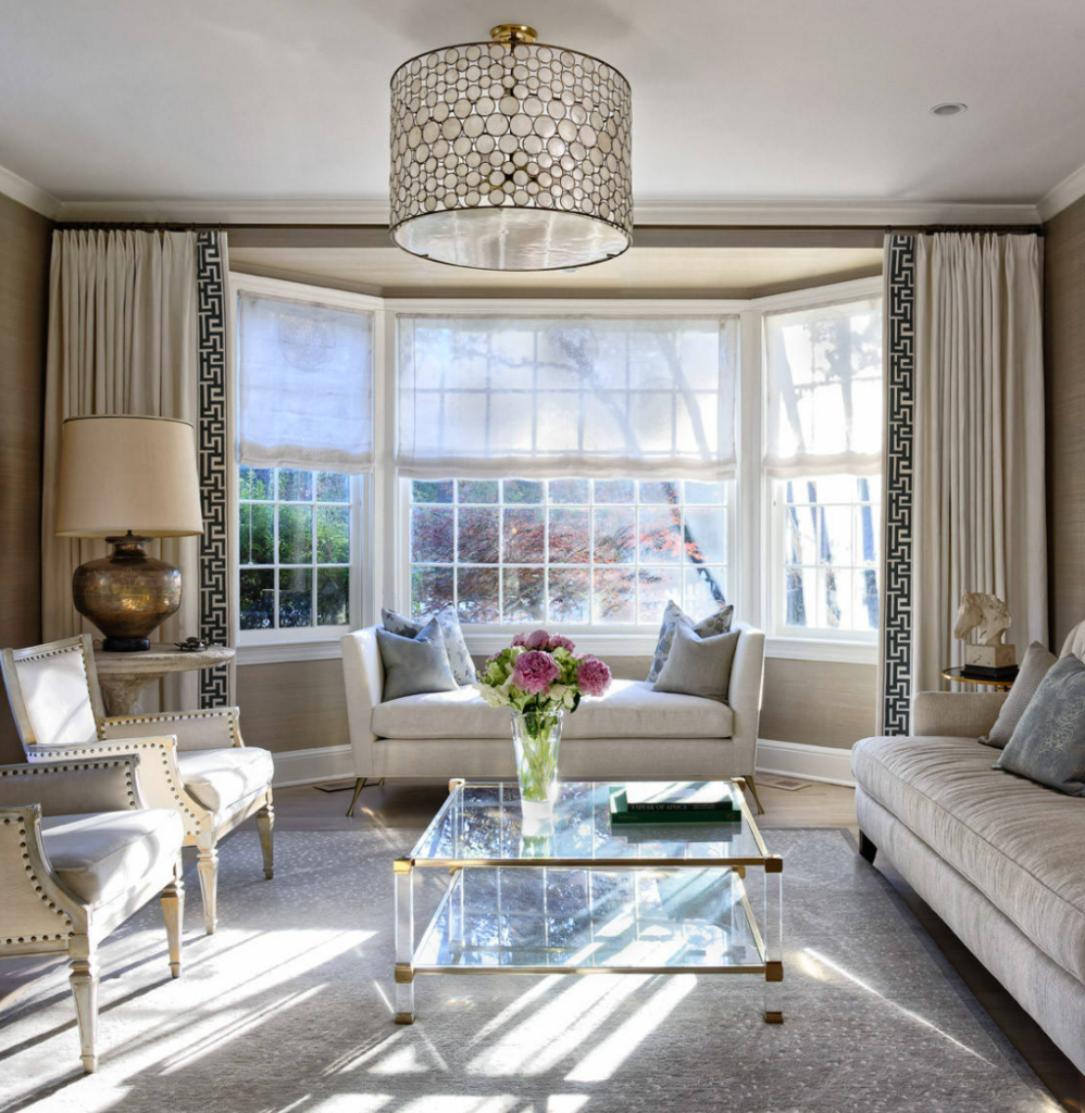 bay window curtain ideas in a cozy living room with soft drapery framing the natural light