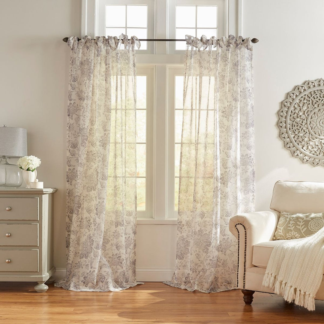 elegant drapes bedroom windows with soft lighting and cozy ambiance
