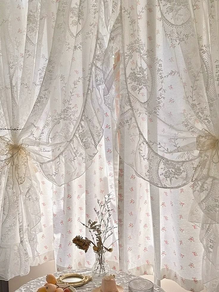 Elegant sheer lace curtains with floral pattern tied back, soft natural light, vintage décor