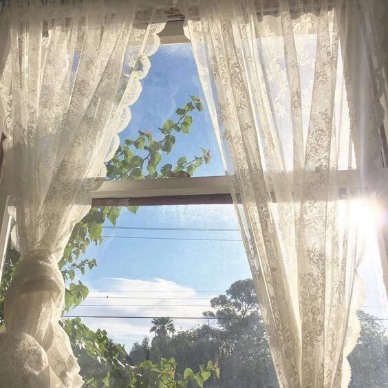 elegant curtains on bay windows idea in a modern sunlit living room
