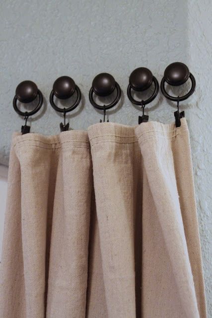 ceiling curtain hardware supporting stylish drapes in a modern living room