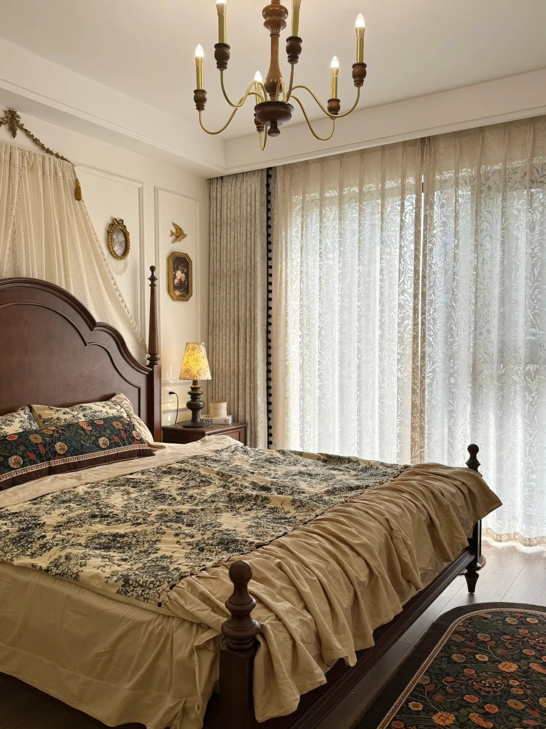 Cozy bedroom with sheer curtain panels, elegant bed, floral bedding, and vintage decor