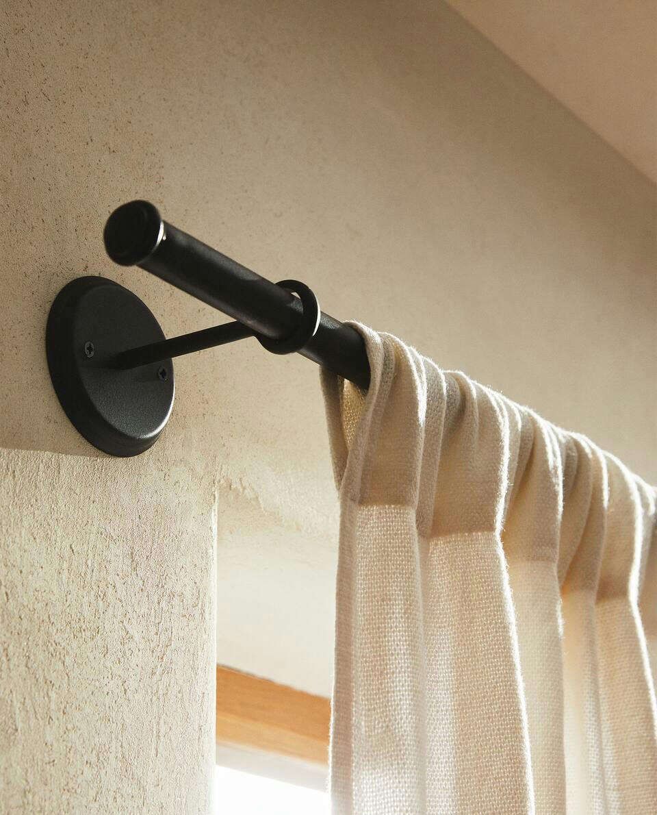Elegant long curtains adding sophistication and warmth to a modern living room.