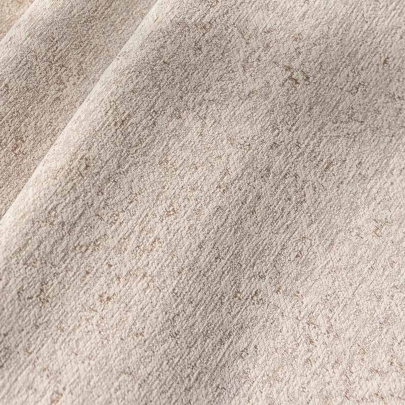 Beige textured blackout curtain fabric with subtle woven pattern