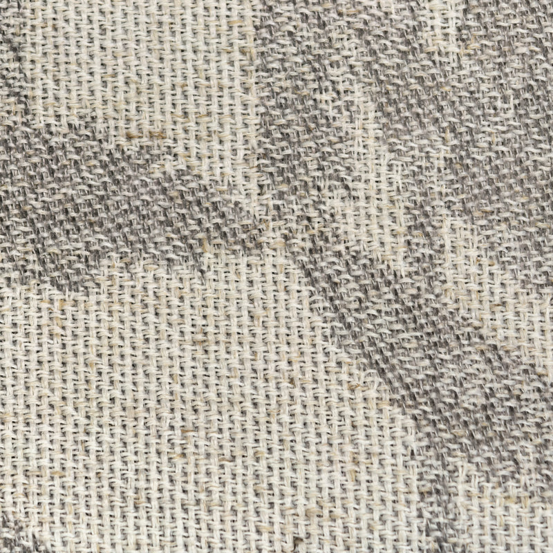 Close-up of beige and gray woven curtain fabric texture, showing detailed weave pattern