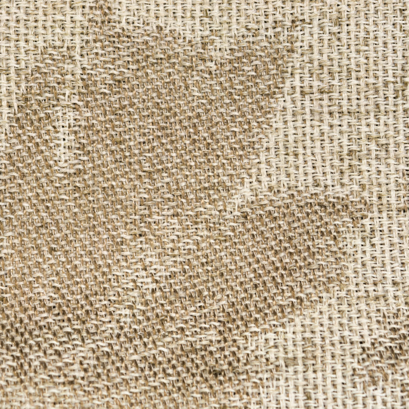 Close-up of textured beige woven curtain fabric with natural fibers