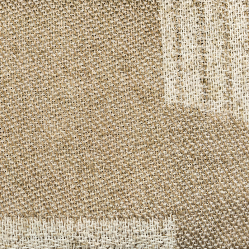 Close-up of beige woven curtain fabric with textured natural linen look