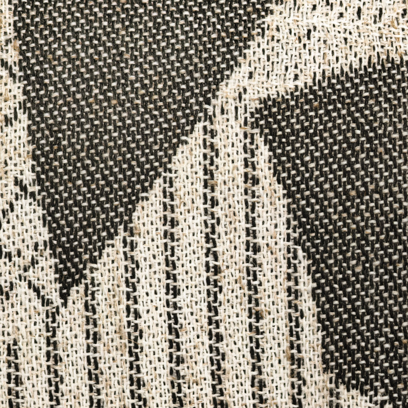 Close-up of black and white woven curtain fabric with geometric pattern