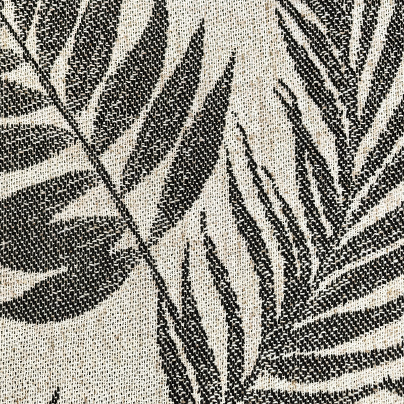 Black palm leaf pattern on beige woven curtain fabric, textured close-up