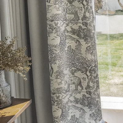 Elegant animal print blackout curtain panel by a window, featuring gray scenic patterns.