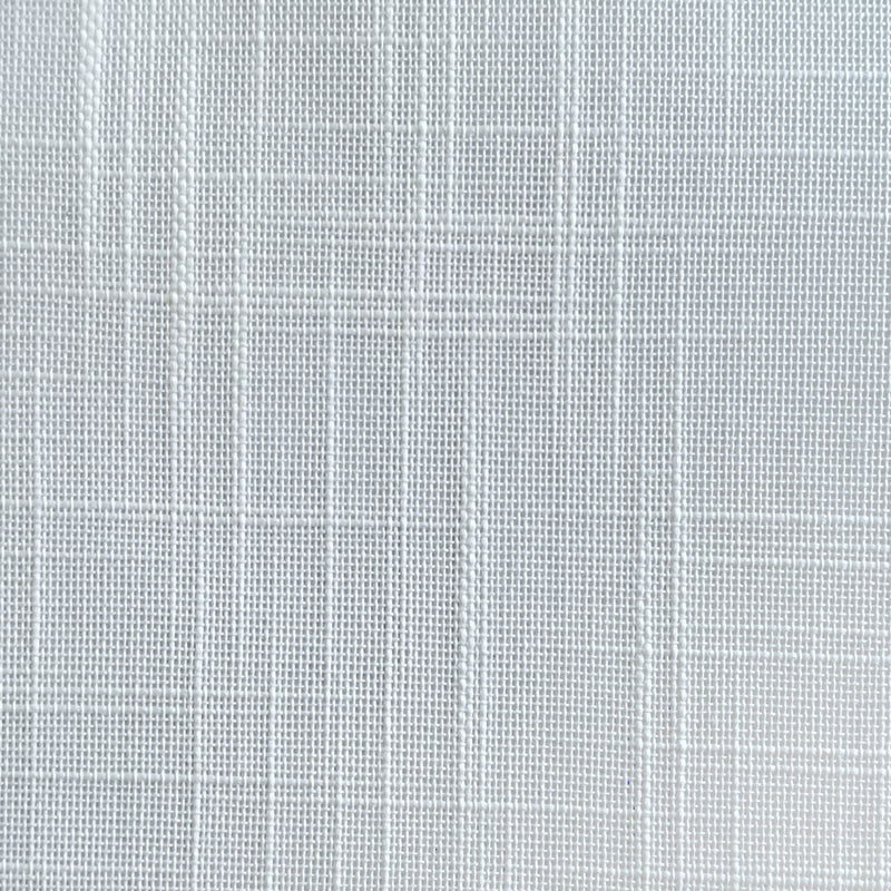 Close-up of white textured curtain fabric with a subtle crisscross pattern.