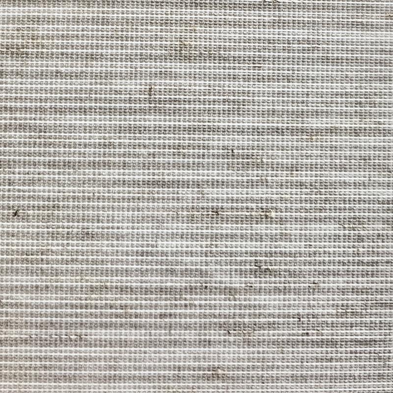 Close-up of textured beige curtain fabric with horizontal woven pattern