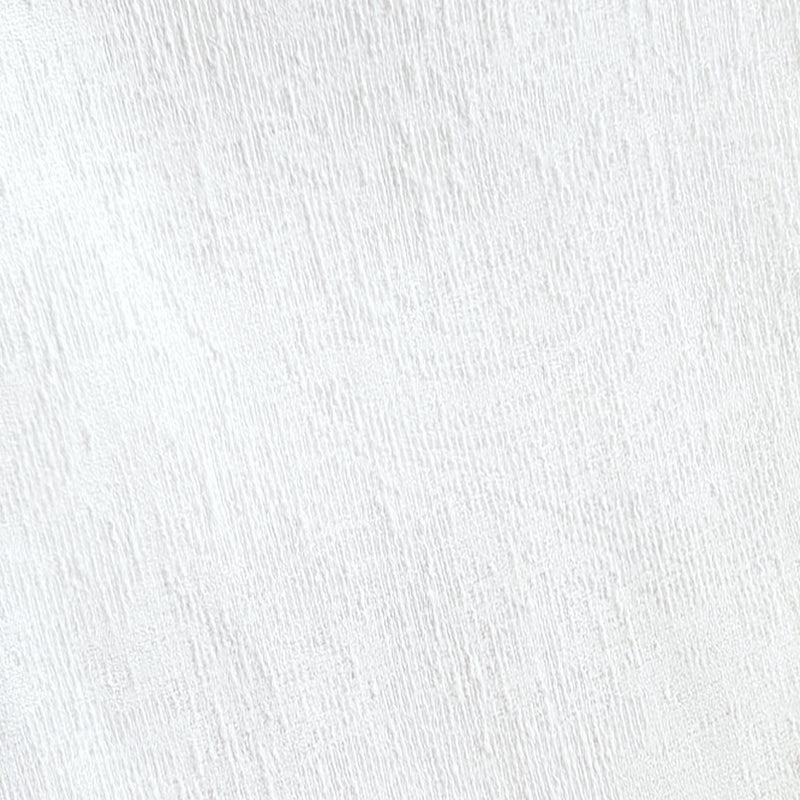 Close-up of white textured curtain fabric, showing subtle woven pattern, suitable for window treatments.
