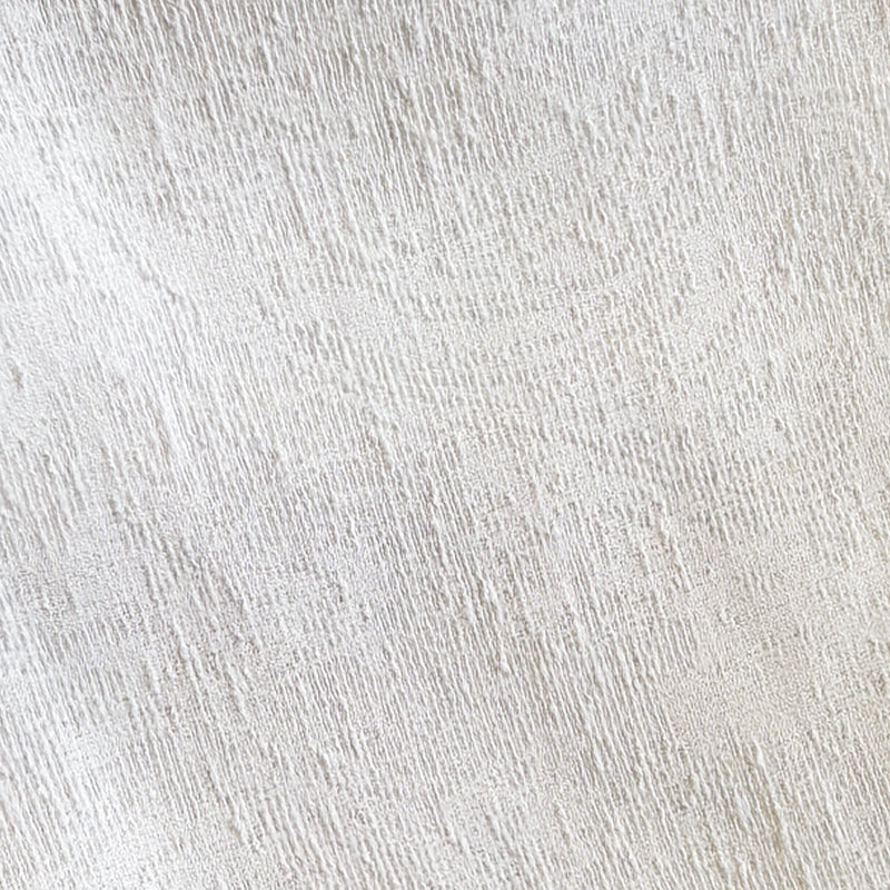 Close-up of textured white blackout curtain fabric, subtle woven linen pattern