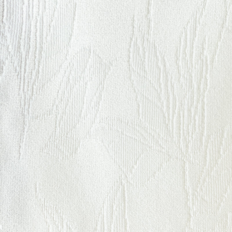 White textured blackout curtain fabric with subtle leaf pattern, close-up view