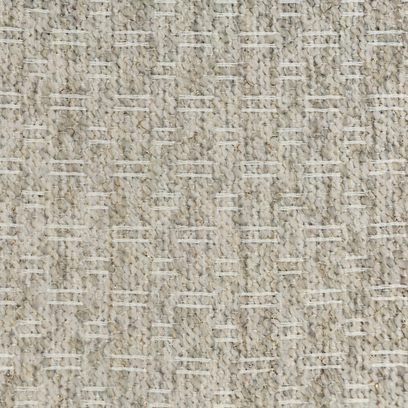 Close-up of textured beige curtain fabric with subtle horizontal white threads.