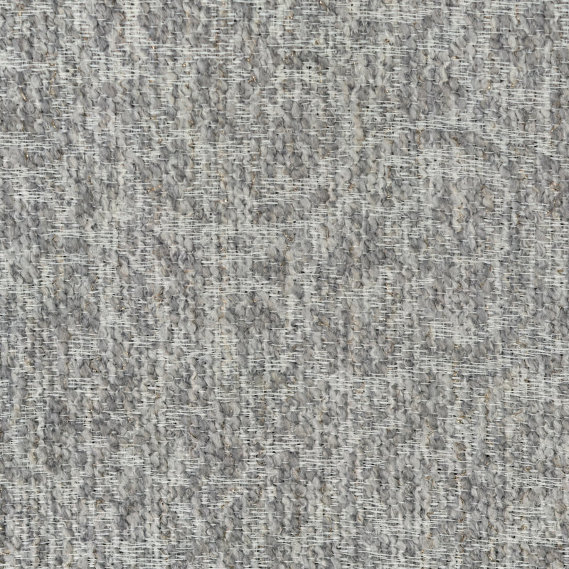 Close-up of textured gray blackout curtain fabric with woven pattern