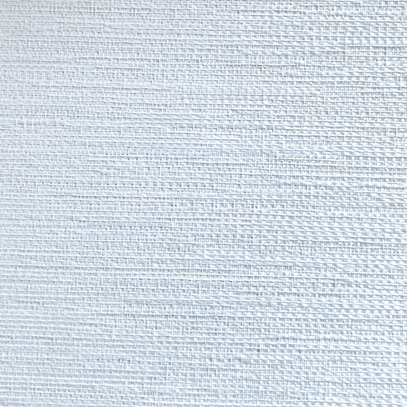 Close-up of light grey textured curtain fabric with a subtle woven pattern