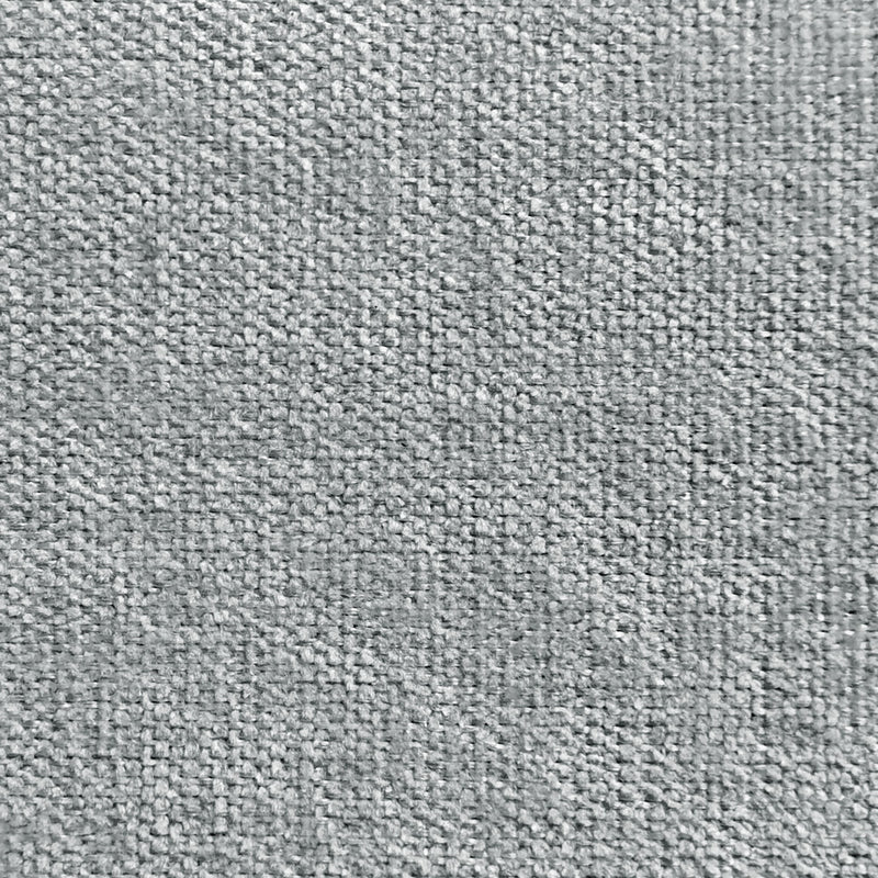Light grey textured curtain fabric sample, close-up showing woven pattern for window treatments.