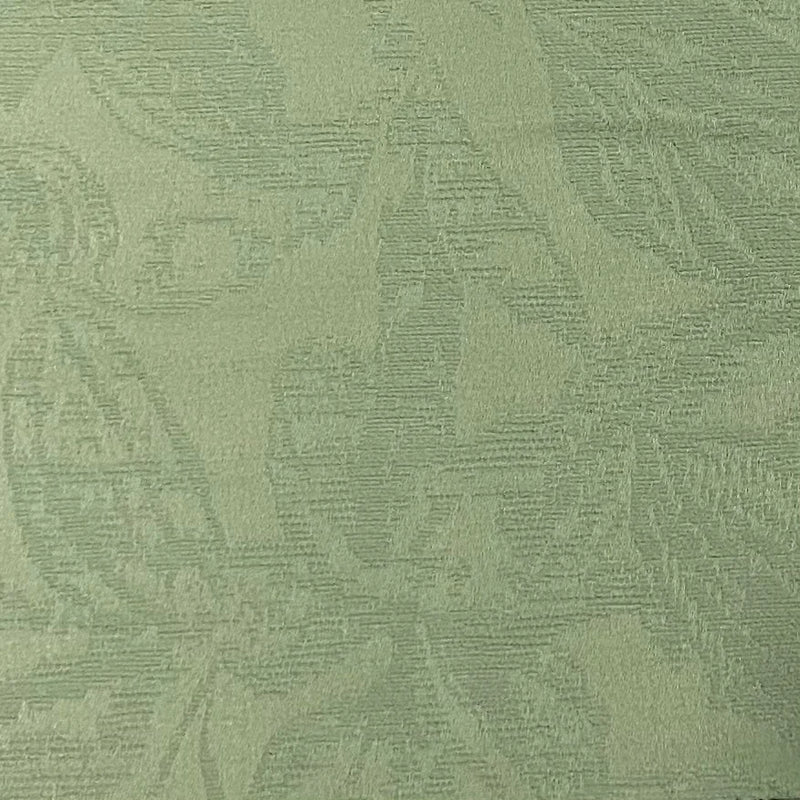Light green blackout curtain fabric with subtle floral jacquard texture, close-up view