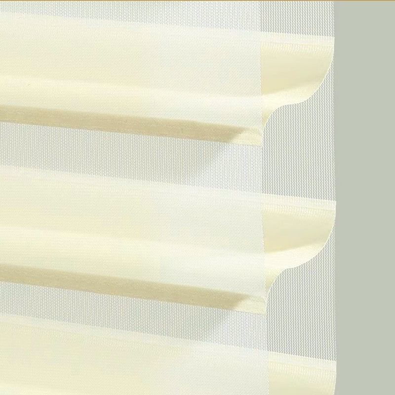 Close-up of modern cream layered sheer curtain with wave-shaped folds