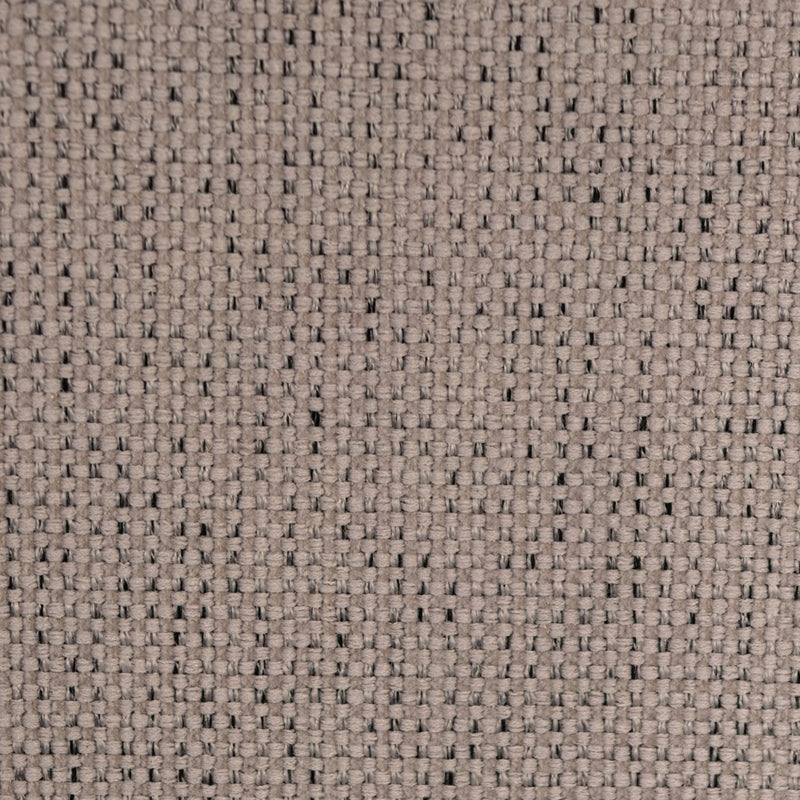 Close-up of beige woven curtain fabric with visible textured pattern