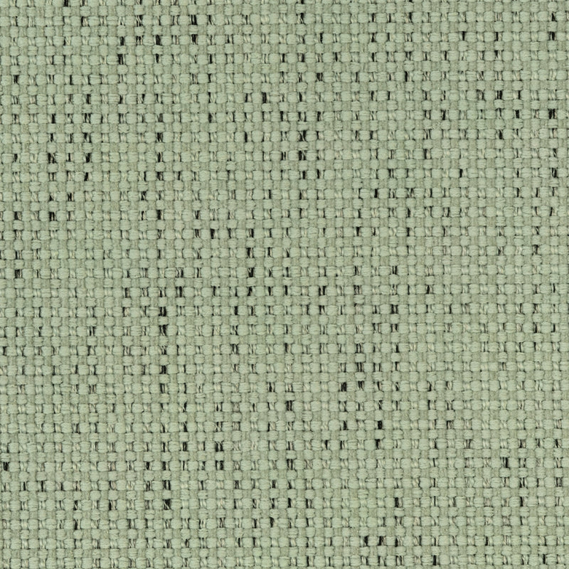 Close-up of light green textured curtain fabric with woven pattern