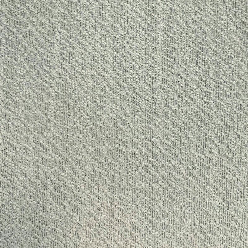 Close-up of textured light grey curtain blackout fabric with woven pattern
