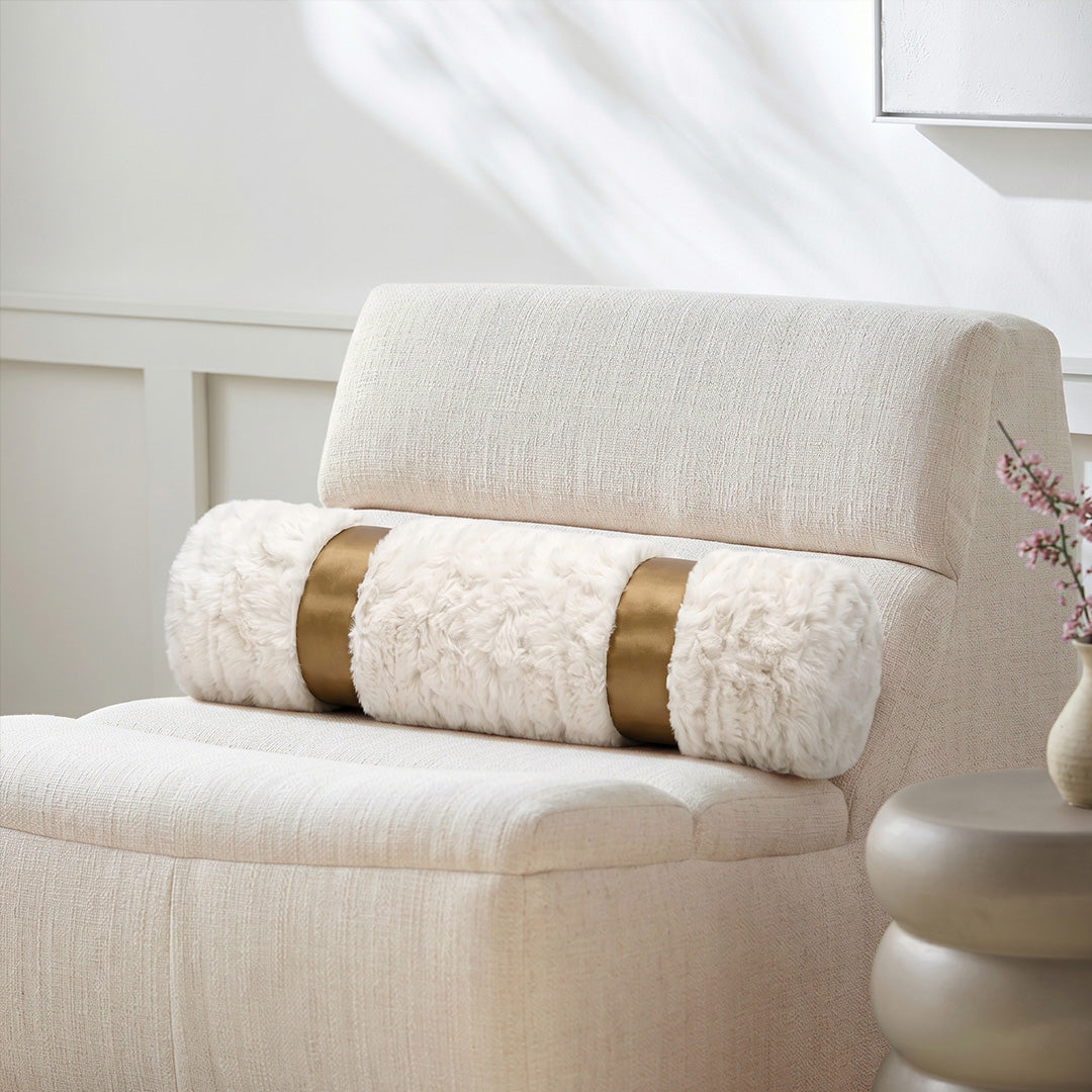 Hugmoom Modern Minimalist Cream Bolster Pillow Cover, 6×24 inch, Faux Fur with Gold Band on Beige Accent Chair