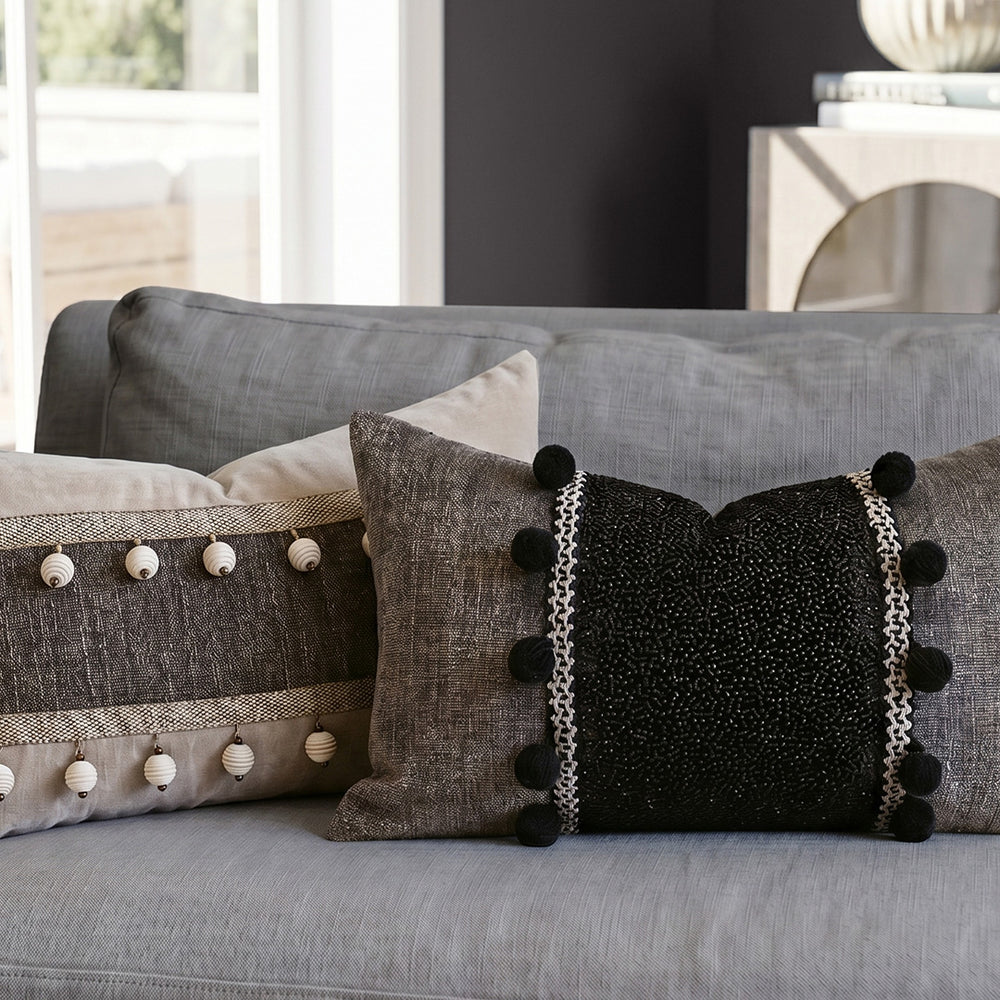 Hugmoom Quiet Luxury Neutral Throw Pillow Cover, Black Beaded Pom Pom Design, Lumbar Cushion in Cozy Bedroom Setting