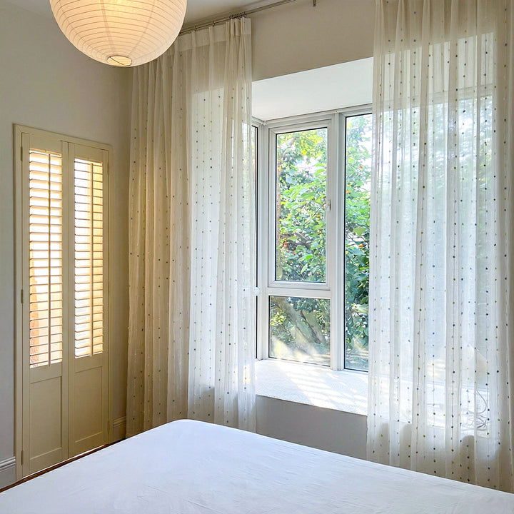 Playful tufted curtain panels in dreamy pastel colors for trendy Airbnb Decor