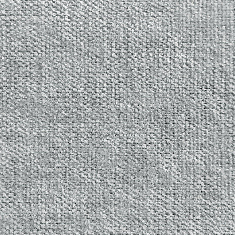 Close-up of light gray curtain fabric with textured, woven pattern for window treatments