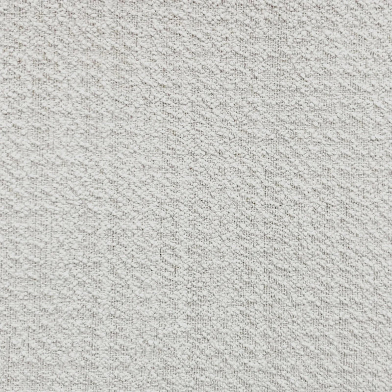 Close-up of textured white blackout curtain fabric with subtle pattern