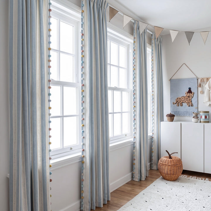hugmoom cozy neutral striped hygge curtains with colorful pom pom trim, styled in modern luxury estate nursery room, custom made window drapes for north america homes