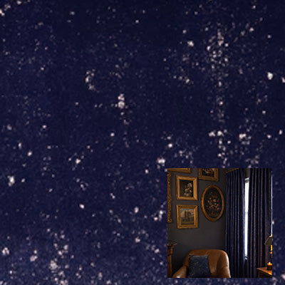 Blue velvet curtain fabric with speckled pattern, hanging in a dark, elegant living room